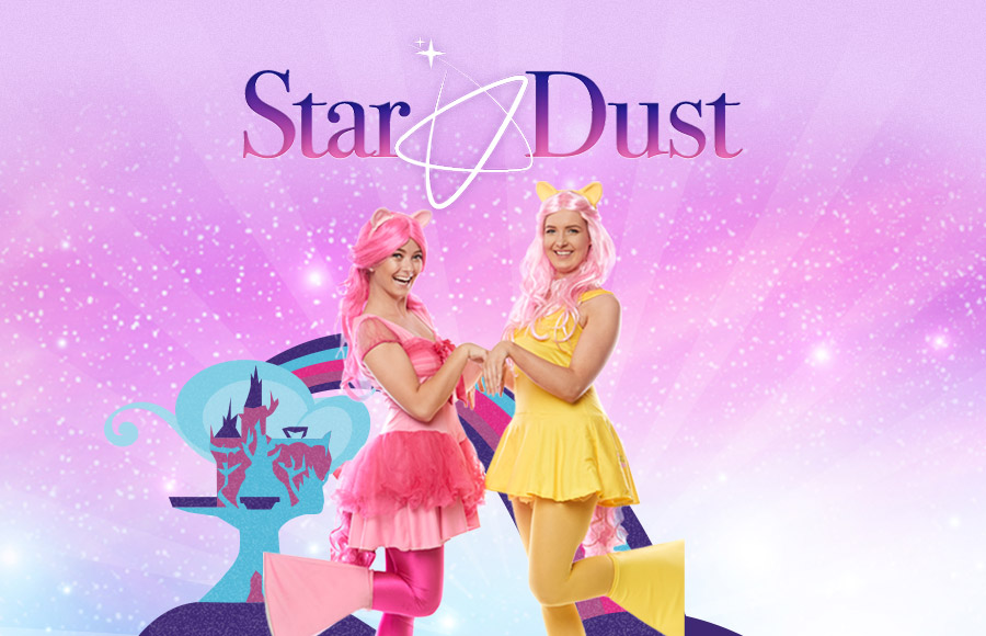 Two woman entertainers are dressed in pink and yellow costumes with ears and tails of a style from the My Little Pony franchise, standing next to a stylized castle illustration. The image is a glittery graphic for Star Dust Kids Entertainment, with images of smiling children in the bottom left corner